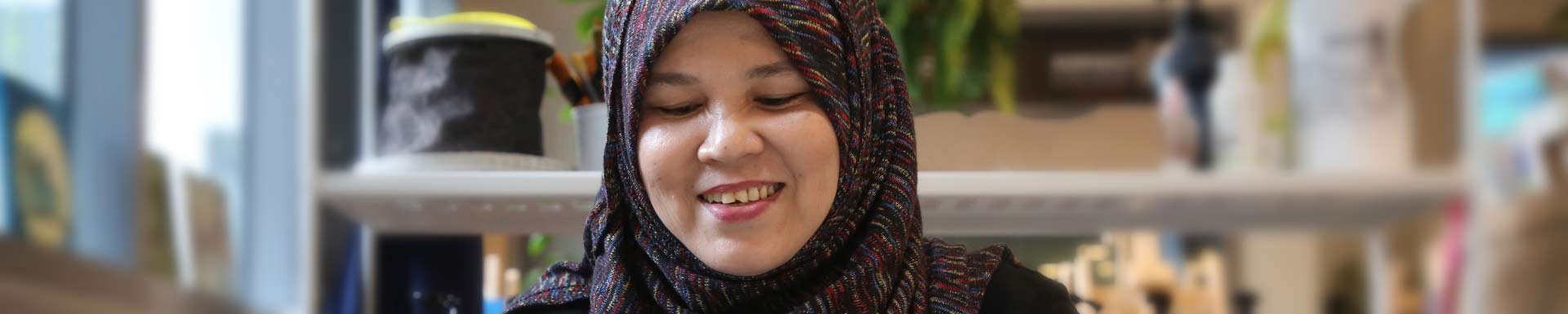 Woman wearing headscarf smiling